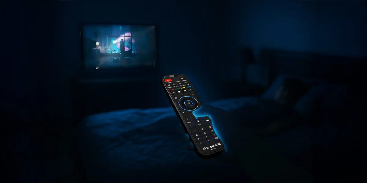 SuperBox S7 Ultra backlit voice remote glowing in a dark room